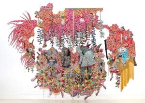 they stood in a time of unknowing… is an intricately decorated tapestry with floral and avian motifs. In irregular shapes, with vines hanging down from top, 3 obscured figures at center wear patterned clothes, and many bare feet extend from the bottom fringe.