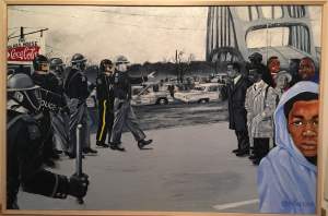 Painting referencing photograph of protesters being attacked on Bloody Sunday 1965 in Selma, with portraits of young Black men murdered in contemporary times mixed into the crowd and foreground.