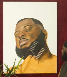 Self Portrait 007: Dissolve is a painting of a Black man with his head tipped back and eyes closed, using a wire pick on his full beard.