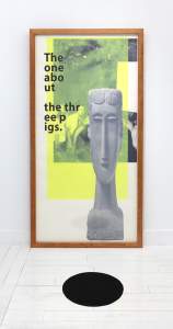 This detail of “horror horror” is a vertical print in  wooden frames, with a thin Modigliani sculptural bust overlaying a black and white snapshot of a group of white people smiling, a yellow transparent rectangle overlaid, and text reading “The one abo ut the the ee p igs.” In front of the frame is a black rubber circle on the floor.