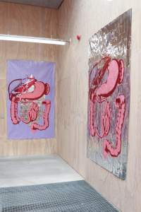 Bliss Point (Autopsies 1 & 2) are two artworks on metallic mylar material, creased in a grid from folds. Each has pink and red illustrated intestines and organs, and the artwork on left has a lilac painted background.