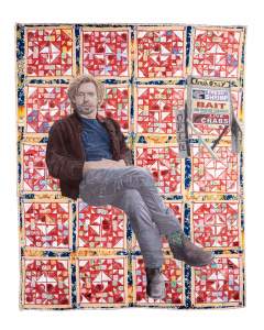 Crosses and Losses is a quilt featuring a man sitting cross-legged, wearing a jacket and jeans, set against a colorful geometric pattern. To the right a smaller store sign is overlaid advertising shrimp, bait, and crabs.