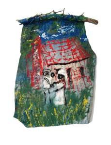 Service depicting two people standing in front of a red-roofed house, with a blue sky above and green grass below, loosely rendered in drips and gestures of paint. The artwork is on an irregular piece of fabric with a stick attached at the top.