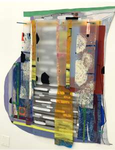 Image Schema #2  is an abstract assemblage on a white wall with layers of opaque plexiglass, and other plastics assembled over a support of acrylic painted shaped canvas, with linear patterns overlaid with vertical strips of color.