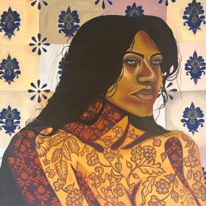 Adorned Self Portrait shows the artist from the chest up. Her face is painted with tones of golden brown, and her body is painted with floral patterns in amber yellow, dark brown, and russet red.  She looks off to our right, and her dark hair falls loosely over her bare shoulders. The background is painted with midnight-blue ornaments in pastel-colored squares.