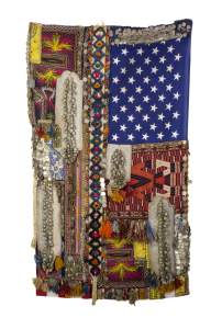 I will love you in the rain, the snow and in the hail / Flag #58 is a flag form, draped down. On the right are 50 stars on a blue field, and the remainder is an assemblage of various patterned and textured fabrics, with silver beaded necklaces and objects.