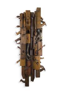 Be tender with me is a vertical assemblage of 18-19th century wooden tools and weapons with two bronze hands nestled into the form.