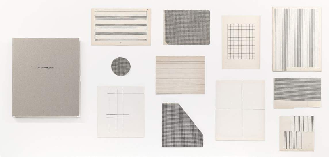 In Graphs & Grids, 12 papers in various tones and sizes are assembled in a loose grid. Each has a different illustration of grids and lines in black.