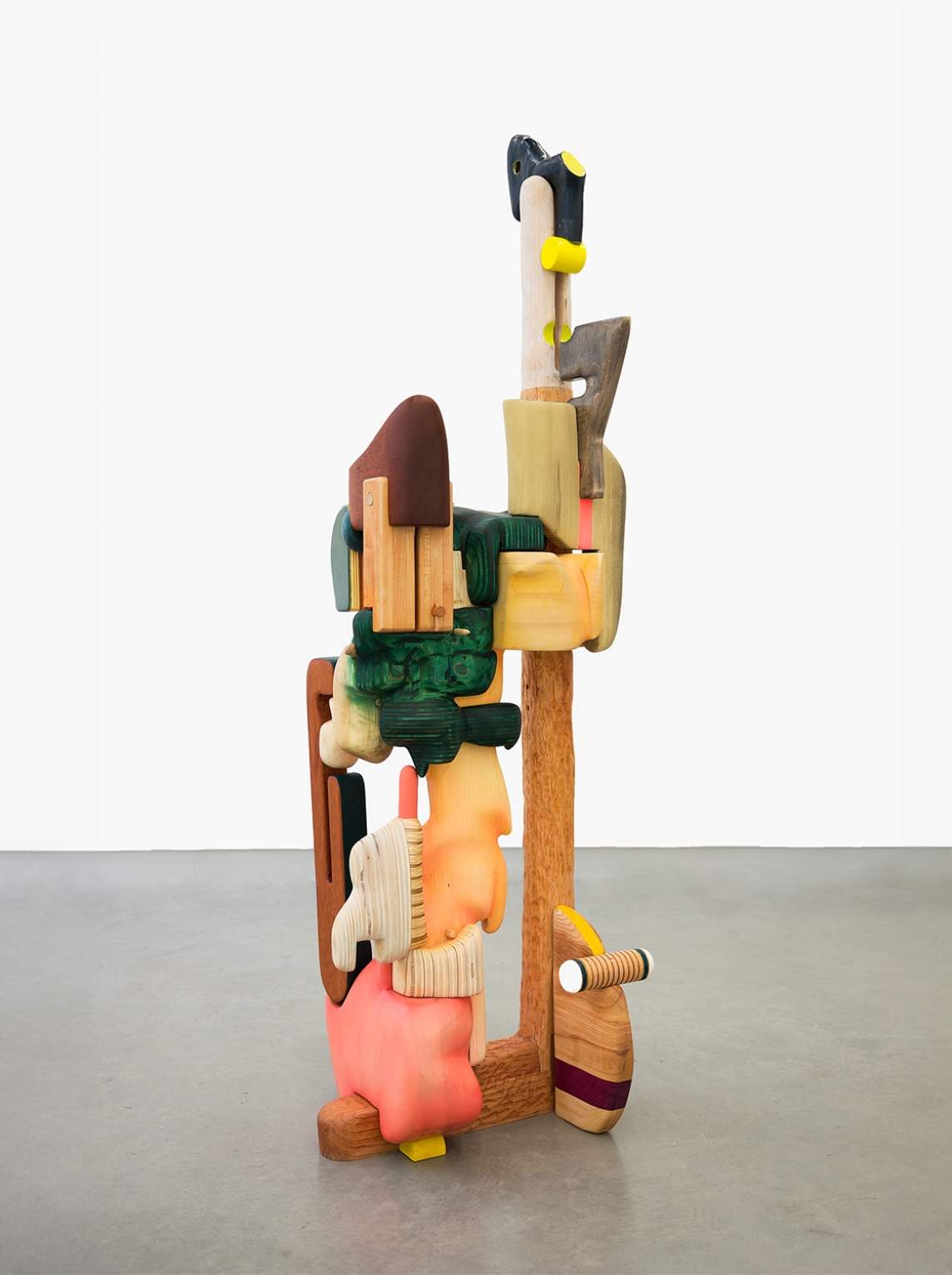 Pump-king Keeper is a free-standing sculpture made up of three vertical beams, on which about a dozen organically shaped pieces ooze or drip.