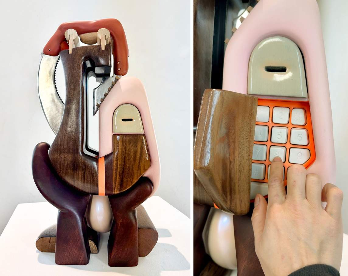 A free-standing sculpture made of interlocking rounded shapes, in stained and painted wood. On the right, a detail view shows a wooden panel that opens to reveal a numerical keypad.