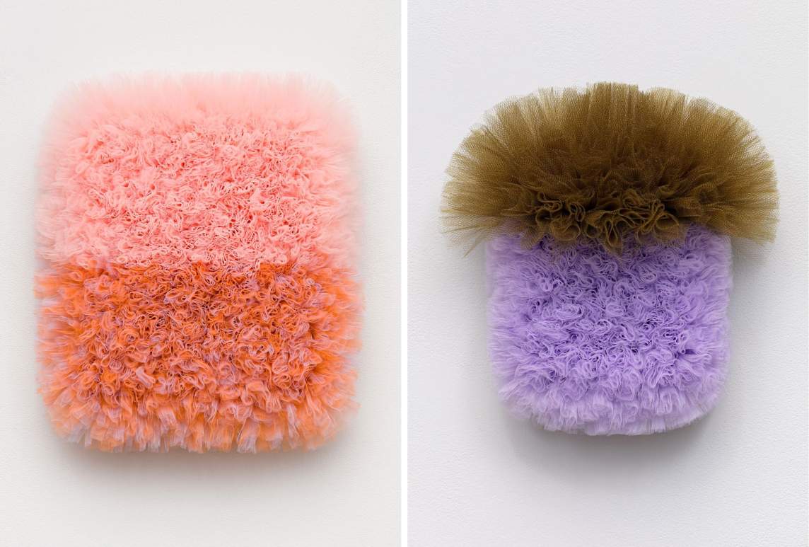 A composite image of two abstract wall sculptures made with tulle fabric. On the left, A Piece of Sand and of Sky is a rounded rectangular shape bisected into two sections of color: light pink at the top and salmon pink at the bottom. On the right, Purple and Full of Hope is a rounded rectangular sculpture made with bunches of lavender tulle fabric, with a fan of brown tulle bursting up at the top.