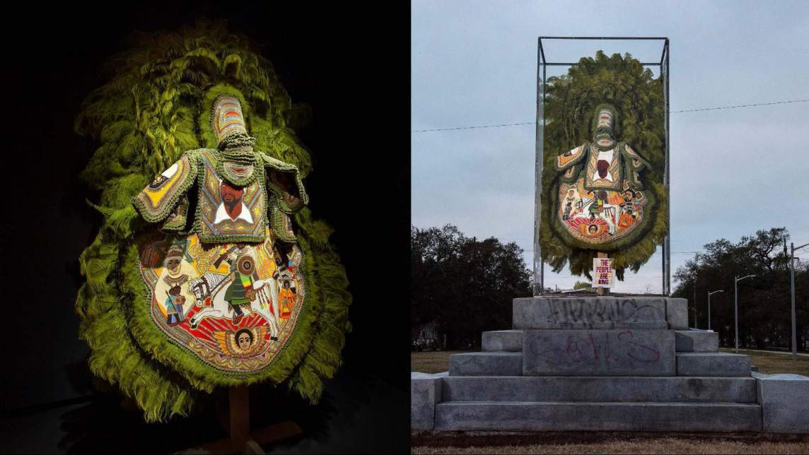 “Jah Defender” is a opulently decorated green feathered suit with beaded apron plate, featuring a Nyabinghi warrior on horseback above the Ethiopian icon of Saint George, flanked on either side by Empress Menan and Haile Selassie. The chest plate features a large portrait of the deceased roots reggae artist, Aeke Beka. On the right, the suit is displayed in a clear box on the pedestal of a former Confederate monument.