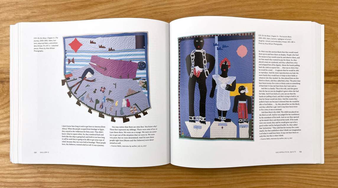 A book is open to show text and two quilts by Yvonne Wells.