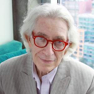 Ted Berger sitting in front of a window