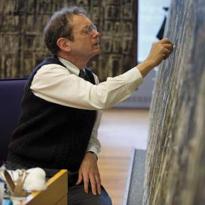 Jim Coddington doing restoration work on a large Jackson Pollock painting