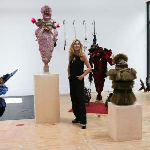 Artist Kristin Meyers standing in her studio at the Joan Mitchell Center surrounded by her sculptures