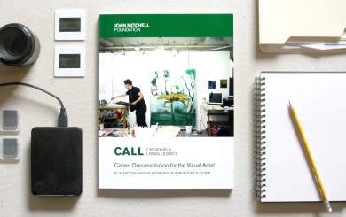 The cover of "Career Documentation for the Visual Artists" guide on a canvas with slides, hard drive, SD cards, lens, folder and notebook