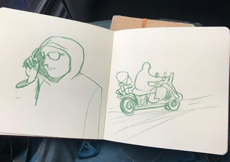 An open sketchbook shows two drawings on the facing pages, both rendered in green crayon. On the left, is a hooded figure wearing glasses and touching the edge of his hooded sweater. On the right is a gestural sketch of a delivery person on a scooter, with packages piled on the back.