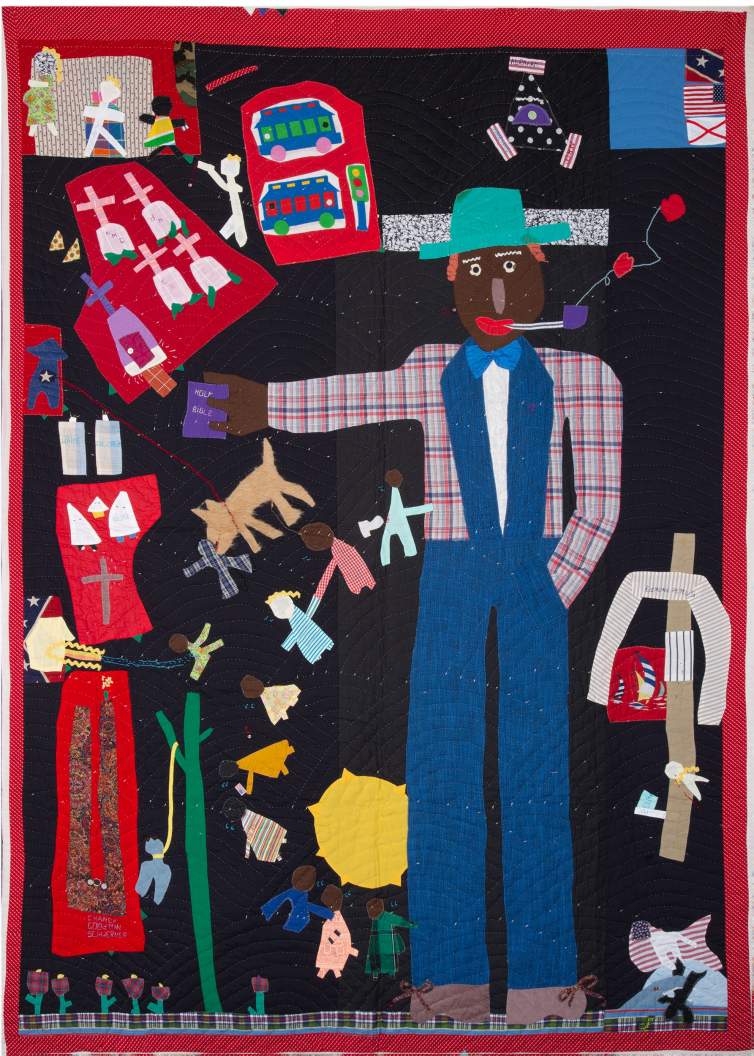 Portrait of the King II is a narrative quilt with a central figure with dark skin plaid shirt, blue suit, pipe, and green hat who extends one arm holding the Holy Bible. Other figurative elements surround him, including a string of children holding hands, a cemetery plot with graves marked with crosses, and two trollies approaching a streetlight.