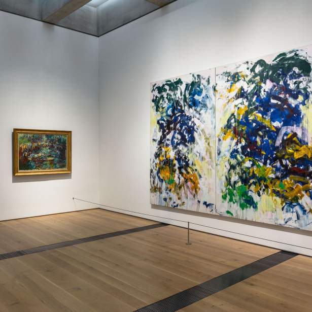 On left, a small landscape by Claude Monet painting hangs and on right, a large abstract painting by Joan Mitchell.