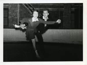 A white man and woman figure skating