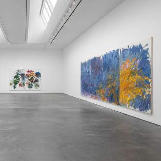 View of two Joan Mitchell's artworks installed in large white walled gallery