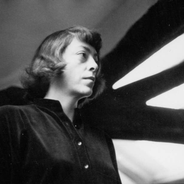 Black and white photograph of artist Joan Mitchell in profile, circa 1960